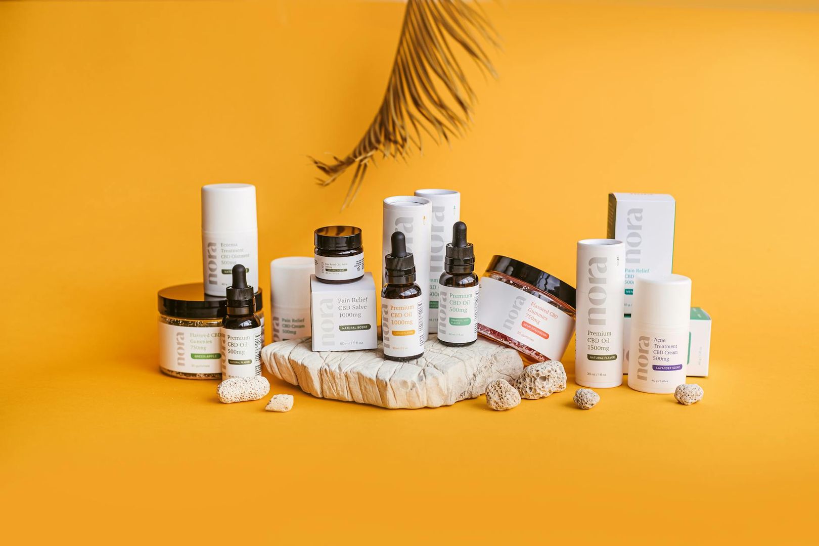 En samling hudvårdsprodukter och CBD-oljor, bland annat Eczema Treatment och Acne Treatment.